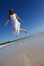 Woman jumping on beach Royalty Free Stock Photo