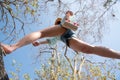 Woman jumping or crossing step over in forest