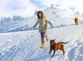Woman jumping with dogs Royalty Free Stock Photo