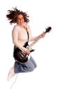 Woman jumping with electric guitar Royalty Free Stock Photo