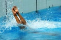 Woman jumping getting into water Royalty Free Stock Photo