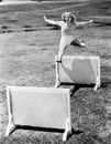 Woman jumping hurdles labeled with years