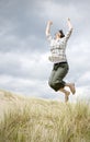 Woman jumping for joy Royalty Free Stock Photo