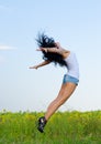 Woman jumping for joy Royalty Free Stock Photo