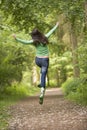 Woman jumping on path Royalty Free Stock Photo