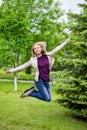 Woman jumping on path Royalty Free Stock Photo