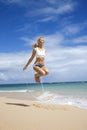 Woman jumping rope on beach. Royalty Free Stock Photo