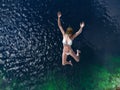 Woman jumping in the sea Royalty Free Stock Photo