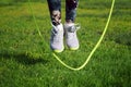 woman jumping on a skipping rope in park Royalty Free Stock Photo