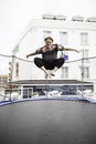Woman jumping on trampoline Royalty Free Stock Photo