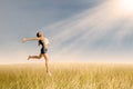 Woman jumping in wheat field Royalty Free Stock Photo