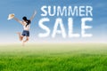 Woman jumps with summer sale cloud Royalty Free Stock Photo