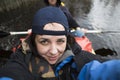 Woman in kayak boat doing selfie. Royalty Free Stock Photo