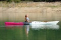 Woman in a kayak breathing fresh air in a lake