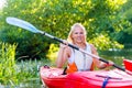 Woman with kayak or canoe on forest river Royalty Free Stock Photo