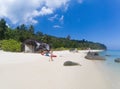 woman with a kayak on an isolated beach in Andaman sea, Koh Adang - solo travel
