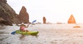 Woman kayak sea. Happy tourist enjoy taking picture outdoors for memories. Woman traveler posing in kayak canoe at sea