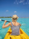 Woman, kayak and tropical ocean in summer in hat, mockup space or blue sky background by island. Person, boat or back