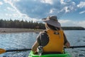 Woman kayaker looking at wildlife in Yellowstone National Park