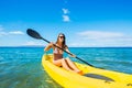 Woman Kayaking in the Ocean on Vacation