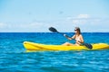 Woman Kayaking in the Ocean on Vacation Royalty Free Stock Photo