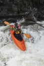 Woman kayaking in river