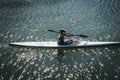 Woman kayaking on the River Thames in Richmond, London, UK.