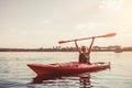 Woman kayaking on sunset Royalty Free Stock Photo