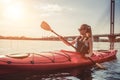 Woman kayaking on sunset Royalty Free Stock Photo
