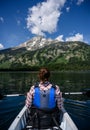 Woman Kayaks in Summer Below Tetons