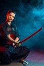 Woman kendo fighter isolated. japanese martial art of sword fighting