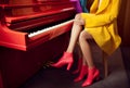 young woman legs red colourful trend fashion piano elegant modern leg. Generative AI. Royalty Free Stock Photo