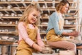 woman and kid making ceramic pots on pottery wheels Royalty Free Stock Photo