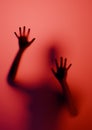 Woman Kidnapped Silhouette on glass red lighting Royalty Free Stock Photo