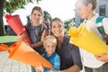 Woman and kids at enrolment day with school cones Royalty Free Stock Photo