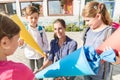 Woman and kids at enrolment day with school cones Royalty Free Stock Photo