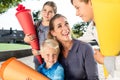 Woman and kids at enrolment day with school cones Royalty Free Stock Photo