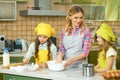 Woman with kids, kitchen. Royalty Free Stock Photo