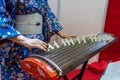 Woman in kimono dress Japanese traditional instrument koto plays Royalty Free Stock Photo