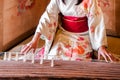 Woman in Kimono dress is playing Koto, Japanese harp Royalty Free Stock Photo