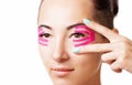 Woman with kinesiology tape on eyelid.