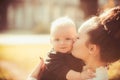 Woman kiss child with love. Mother and little son. Mom and baby boy outdoor. Mothers day concept. Happy family enjoy Royalty Free Stock Photo