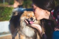 Woman kissing dog with copy space for text Royalty Free Stock Photo