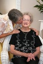 Woman Kissing Elderly Mother