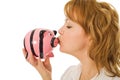 Woman kissing pigg-bank Royalty Free Stock Photo