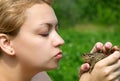 Woman kissing a toad Royalty Free Stock Photo