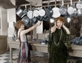 Woman in kitchen beating on pots and pans Royalty Free Stock Photo