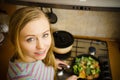 Woman cooking stir fry frozen vegetable on pan Royalty Free Stock Photo