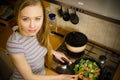 Woman cooking stir fry frozen vegetable on pan Royalty Free Stock Photo