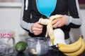 Slicing Fresh Banana for Nourishing Smoothie